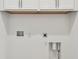 Laundry room featuring a washing machine hookup and upper cabinets for storage at 9530 Coastline Way, Parrish, FL 34219