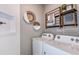 Well-organized laundry room equipped with modern machines and decorative wall art at 9530 Coastline Way, Parrish, FL 34219