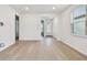 Bright living room featuring neutral walls, wood-look tile flooring, recessed lighting, and natural light at 9530 Coastline Way, Parrish, FL 34219