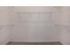 Spacious walk-in closet equipped with wire shelving for organized storage solutions at 10317 Cross River Trl, Parrish, FL 34219
