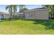 The home features a big backyard, perfect for outdoor activities and relaxation, with a screened in porch at 1084 Berkshire Ln, Tarpon Springs, FL 34688