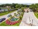 The community features a beautiful entrance with a water fountain and palm trees at 1084 Berkshire Ln, Tarpon Springs, FL 34688