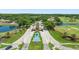 Community entrance showcasing fountains, ponds, lush landscaping and golf course at 1084 Berkshire Ln, Tarpon Springs, FL 34688