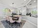 Elegant dining room with a large table, seating for eight, and mirrored wall accents at 1084 Berkshire Ln, Tarpon Springs, FL 34688