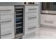 Close up of a wine cooler in a modern kitchen at 1084 Berkshire Ln, Tarpon Springs, FL 34688