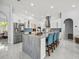Bright, open kitchen with large island, stainless steel appliances, and modern white cabinetry at 1084 Berkshire Ln, Tarpon Springs, FL 34688