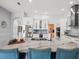 Modern kitchen boasts a central island with seating, stainless steel appliances, and ample storage space at 1084 Berkshire Ln, Tarpon Springs, FL 34688