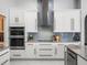 Well-appointed kitchen with stainless steel appliances, subway tile backsplash, and ample counter space at 1084 Berkshire Ln, Tarpon Springs, FL 34688