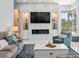 Spacious living room with fireplace, television, and stylish decor at 1084 Berkshire Ln, Tarpon Springs, FL 34688