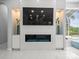 Living room area with fireplace, television, and stylish furniture at 1084 Berkshire Ln, Tarpon Springs, FL 34688