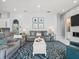 The inviting living room has lots of seating and blue accents at 1084 Berkshire Ln, Tarpon Springs, FL 34688
