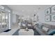 Open-concept living room with white marble floors, stylish decor, and bright atmosphere at 1084 Berkshire Ln, Tarpon Springs, FL 34688