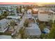 Neighborhood street with single-Gathering homes and palm trees near a sunset beach at 150 95Th Ave, Treasure Island, FL 33706
