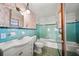 Retro bathroom showcasing unique tile work, a vanity sink, and a tub shower at 18906 Crescent Rd, Odessa, FL 33556