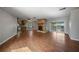 Living room with cozy stone fireplace, tile ceiling and sliding doors to the Florida room at 18906 Crescent Rd, Odessa, FL 33556