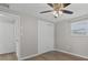 Bedroom with neutral walls, wood-look flooring, and a closet for ample storage at 2166 Dixie Garden Loop, Holiday, FL 34690