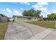 Charming single-Gathering home featuring a well-maintained lawn, attached garage, and inviting curb appeal in a desirable neighborhood at 2166 Dixie Garden Loop, Holiday, FL 34690