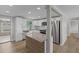 Modern kitchen featuring white cabinets, stainless steel appliances, and a stylish island at 2166 Dixie Garden Loop, Holiday, FL 34690