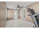 Versatile room with tiled floor, ceiling fan, and access to the outside at 2166 Dixie Garden Loop, Holiday, FL 34690