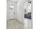 Inviting entryway with a view into a bedroom featuring a blue patterned bedspread at 2305 W Kentucky Ave, Tampa, FL 33607