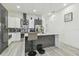 Open kitchen features sleek cabinetry, stainless appliances, and a spacious island with bar seating at 2305 W Kentucky Ave, Tampa, FL 33607