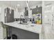 Stylish kitchen features stainless steel appliances, an island with seating, and modern pendant lights at 2305 W Kentucky Ave, Tampa, FL 33607