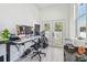 Bright office with french doors leading to outdoor area and a modern desk setup at 2305 W Kentucky Ave, Tampa, FL 33607