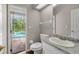 Bathroom featuring granite vanity and direct access to the outdoor pool area at 2512 Clubhouse Dr, Plant City, FL 33566