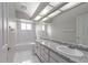 Spacious bathroom with dual vanities and ample lighting at 2512 Clubhouse Dr, Plant City, FL 33566