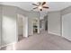 Bright main bedroom with two closets, ensuite bath entry, and view into hallway at 2512 Clubhouse Dr, Plant City, FL 33566