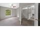 Spacious main bedroom featuring stairs, an entry door, and a backyard view at 2512 Clubhouse Dr, Plant City, FL 33566