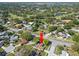 Aerial view of home, surrounding neighborhood, trees, and community at 2961 Stockwood Dr, Clearwater, FL 33761
