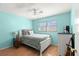 Bedroom with hardwood floors, a ceiling fan and a guitar at 2961 Stockwood Dr, Clearwater, FL 33761