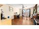 Bonus room with hardwood floors, ceiling fan, desk, piano, and large bright windows at 2961 Stockwood Dr, Clearwater, FL 33761