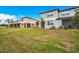 Exterior view of the home's backyard and landscaping at 30752 Veridian Way, Wesley Chapel, FL 33545