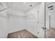 Walk-in closet features wire shelving and neutral paint at 30752 Veridian Way, Wesley Chapel, FL 33545