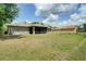 Large backyard featuring a screened-in patio and plenty of green space, perfect for outdoor enjoyment and privacy at 3206 Shalimar Ter, North Port, FL 34286