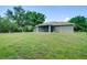 Expansive backyard with a screened patio, perfect for outdoor entertaining at 3206 Shalimar Ter, North Port, FL 34286