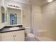 Spacious bathroom with a tub and shower combo, a vanity with sink, and a standard toilet at 3206 Shalimar Ter, North Port, FL 34286