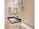 Bright bathroom with modern mirror and vanity at 3206 Shalimar Ter, North Port, FL 34286