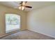 Cozy bedroom featuring plush carpet and a sunny window view at 3206 Shalimar Ter, North Port, FL 34286