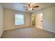 Comfortable bedroom with ceiling fan, natural light, and walk-in closet access at 3206 Shalimar Ter, North Port, FL 34286