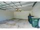 A spacious garage has ample room for vehicle storage and projects, as well as overhead lighting and storage at 3206 Shalimar Ter, North Port, FL 34286