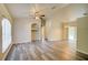 Open-concept living space with archways and sliding glass door at 3206 Shalimar Ter, North Port, FL 34286