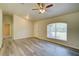 Spacious living area featuring a ceiling fan and natural light at 3206 Shalimar Ter, North Port, FL 34286