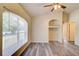 Bright living area with large window and decorative shelving niche at 3206 Shalimar Ter, North Port, FL 34286