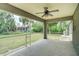 An airy screened-in patio provides a relaxing outdoor living space with views of the lush backyard and mature trees at 3206 Shalimar Ter, North Port, FL 34286
