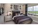 Modern bedroom with a rustic design and decor, natural light, and a view of green space at 3213 Lumber Falls Dr, Plant City, FL 33565