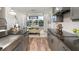 Stylish kitchen featuring stainless steel appliances, pendant lighting, and an adjacent dining area at 3213 Lumber Falls Dr, Plant City, FL 33565