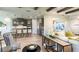 Open-concept living area featuring a modern kitchen, comfortable seating, and stylish decor at 3213 Lumber Falls Dr, Plant City, FL 33565